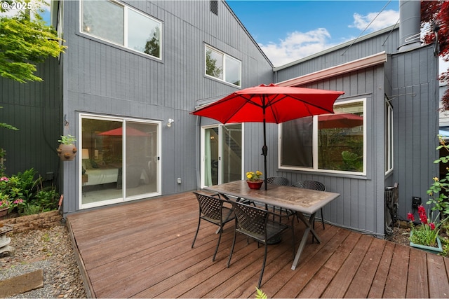 wooden terrace featuring outdoor dining space