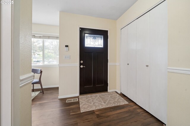17601 NW Rolling Hill Ln, Beaverton, OR 97006 - foyer featuring dark wood-type flooring, plenty of natural light, and baseboards