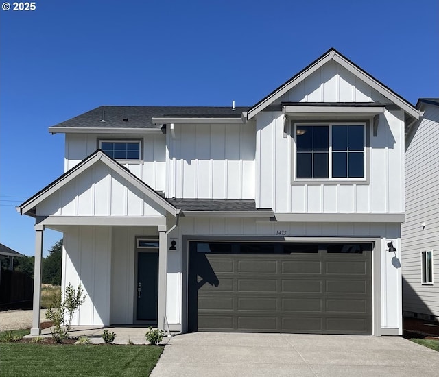 modern inspired farmhouse with an attached garage, a shingled roof, board and batten siding, and concrete driveway