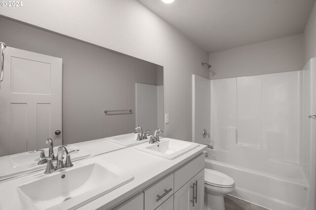 full bathroom with shower / bath combination, vanity, tile patterned flooring, and toilet