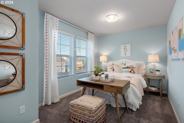 bedroom featuring carpet flooring and baseboards