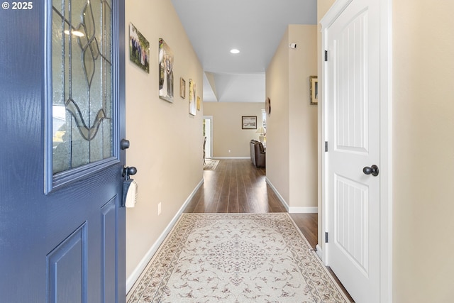 hall with dark wood-type flooring