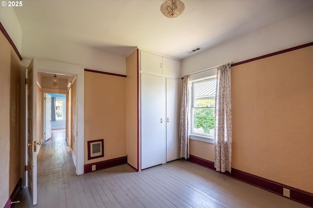 470 W 4th St, Coquille, OR 97423 - unfurnished bedroom with light wood-style flooring, a closet, and baseboards
