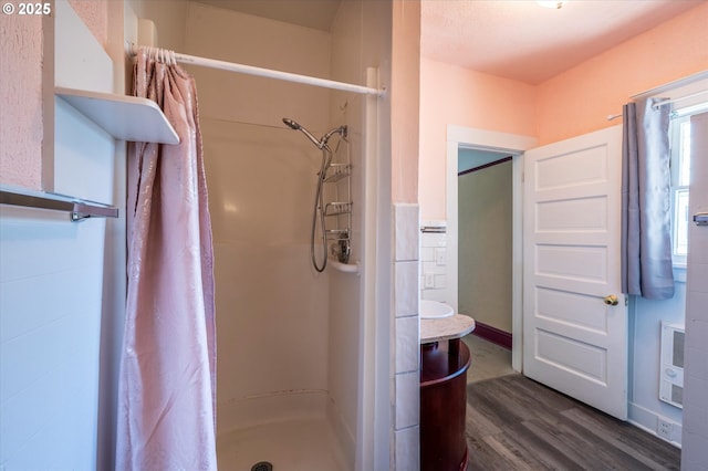 470 W 4th St, Coquille, OR 97423 - full bathroom featuring a stall shower, wood finished floors, and heating unit