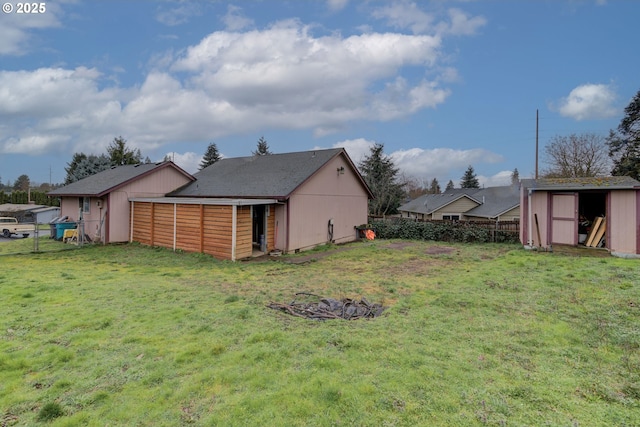 view of shed featuring fence