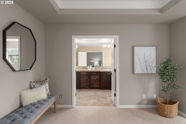 5392 NW 133rd Ave, Portland, OR 97229 - hallway featuring a tray ceiling, light carpet, and crown molding