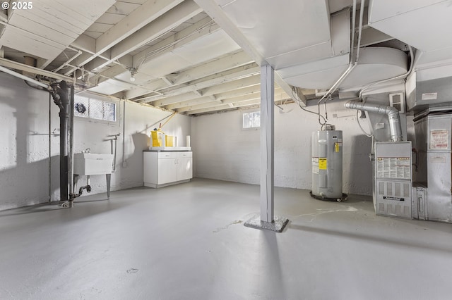 below grade area featuring water heater, a sink, and heating unit