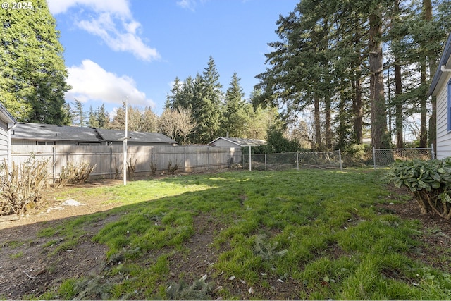 view of yard with a fenced backyard