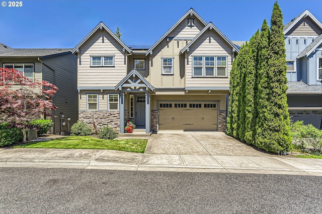 10183 NW Crossing Dr, Portland, OR 97229 - view of front of property with a garage, stone siding, driveway, and board and batten siding