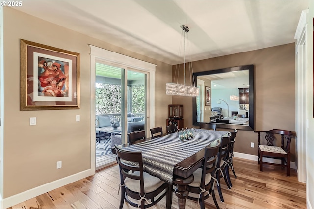 10183 NW Crossing Dr, Portland, OR 97229 - dining room with light wood finished floors and baseboards