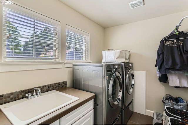 10183 NW Crossing Dr, Portland, OR 97229 - washroom with independent washer and dryer and dark tile patterned floors