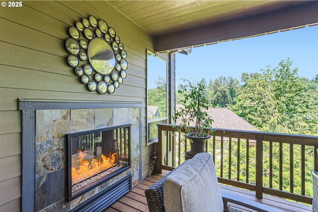 10183 NW Crossing Dr, Portland, OR 97229 - wooden deck featuring a tiled fireplace