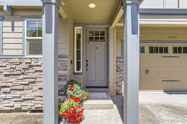 10183 NW Crossing Dr, Portland, OR 97229 - entrance to property featuring stone siding and a garage