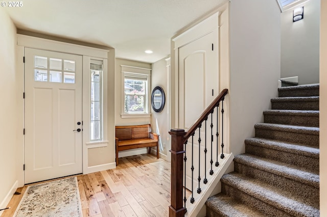 10183 NW Crossing Dr, Portland, OR 97229 - foyer entrance featuring light wood finished floors, stairway, baseboards, and recessed lighting