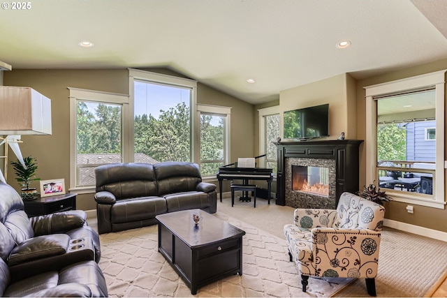 10183 NW Crossing Dr, Portland, OR 97229 - living room with vaulted ceiling, a glass covered fireplace, healthy amount of natural light, light colored carpet, and recessed lighting