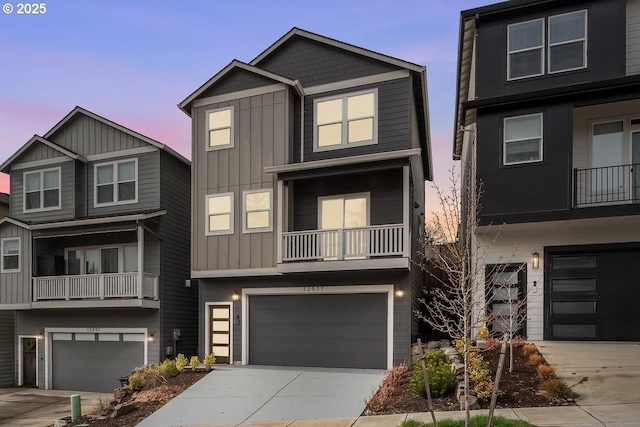 12977 SE Creekside Ter, Happy Valley, OR 97086 - view of front of house featuring board and batten siding, an attached garage, and concrete driveway