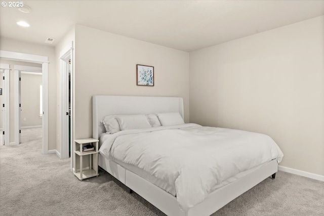 bedroom with carpet, baseboards, and recessed lighting