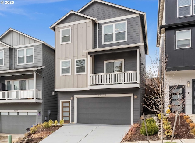 view of front of property featuring board and batten siding, concrete driveway, and an attached garage