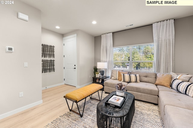 living room with light hardwood / wood-style flooring