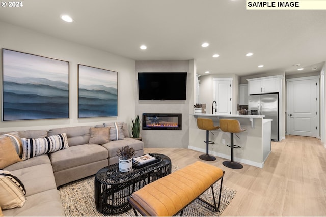 living room with light hardwood / wood-style flooring