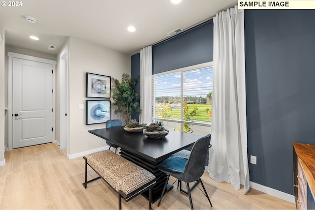 dining room with light hardwood / wood-style flooring