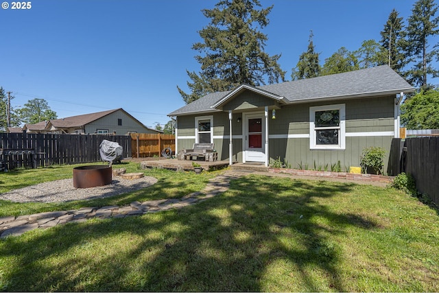 1646 E Gibbs Ave, Cottage Grove, OR 97424 - bungalow featuring a fenced backyard, a front lawn, and roof with shingles