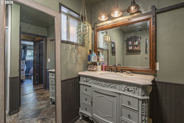 1646 E Gibbs Ave, Cottage Grove, OR 97424 - bathroom featuring a healthy amount of sunlight, a wainscoted wall, and stone finish flooring