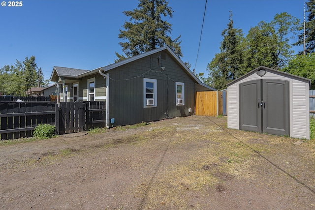 1646 E Gibbs Ave, Cottage Grove, OR 97424 - view of home's exterior featuring fence, an outbuilding, and a shed