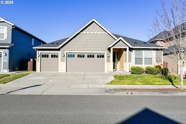 view of front of house with a garage and a front yard