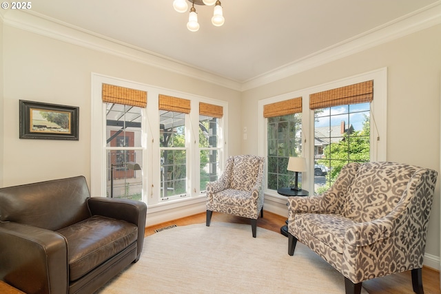 4052 NE 22nd Ave, Portland, OR 97212 - sitting room with crown molding, plenty of natural light, and light wood-style floors