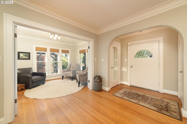 4052 NE 22nd Ave, Portland, OR 97212 - foyer entrance featuring arched walkways, ornamental molding, and light wood finished floors