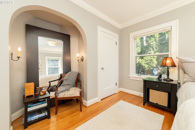 4052 NE 22nd Ave, Portland, OR 97212 - sitting room with wood finished floors, healthy amount of natural light, crown molding, and arched walkways