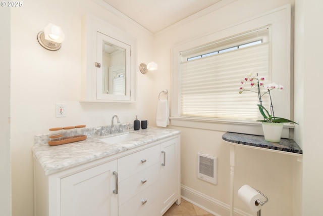 4052 NE 22nd Ave, Portland, OR 97212 - bathroom featuring heating unit, vanity, plenty of natural light, and crown molding