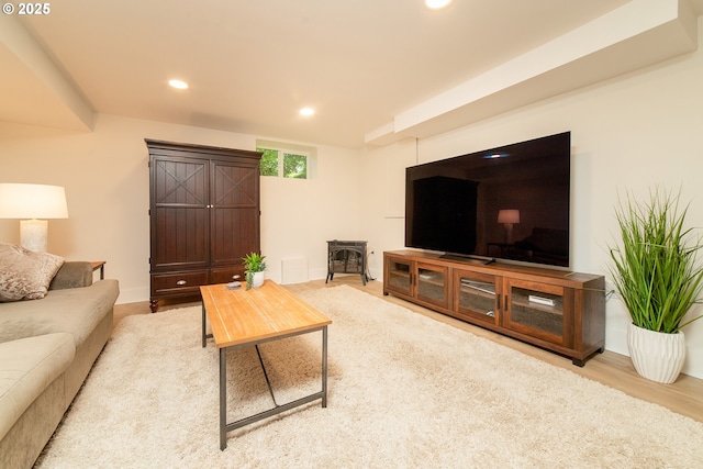 4052 NE 22nd Ave, Portland, OR 97212 - living room featuring recessed lighting, a wood stove, and wood finished floors