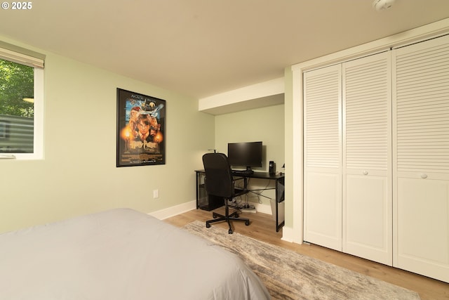 4052 NE 22nd Ave, Portland, OR 97212 - bedroom featuring wood finished floors, a closet, and an office area