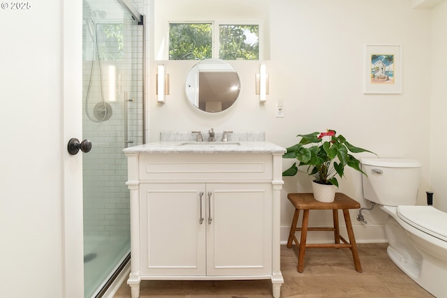4052 NE 22nd Ave, Portland, OR 97212 - full bath with vanity, a tile shower, and wood finished floors