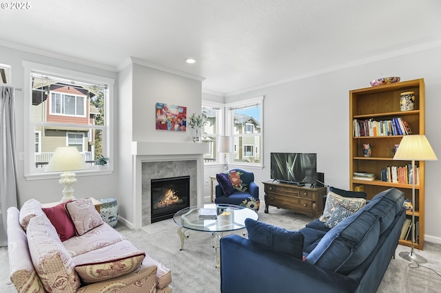 carpeted living room featuring recessed lighting, a premium fireplace, baseboards, and ornamental molding