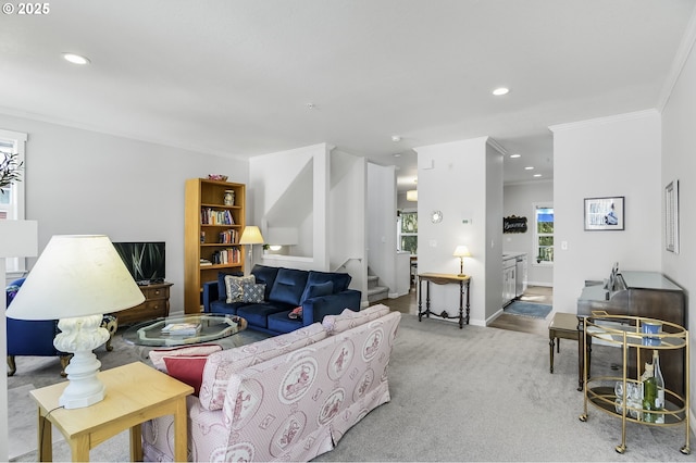 carpeted living room with stairs, crown molding, recessed lighting, and baseboards