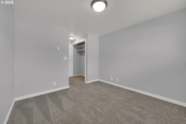 unfurnished bedroom with carpet flooring and a closet