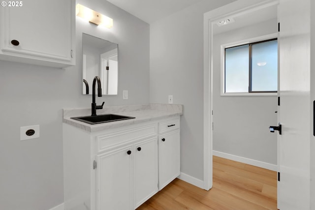 bathroom featuring vanity and hardwood / wood-style floors