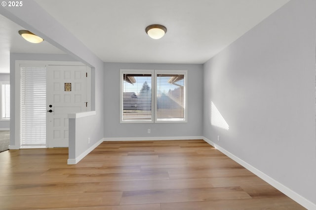 entrance foyer with a wealth of natural light and light hardwood / wood-style floors