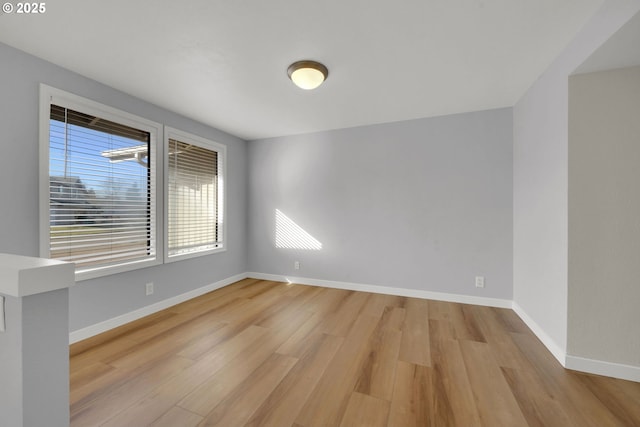 unfurnished room featuring light hardwood / wood-style flooring