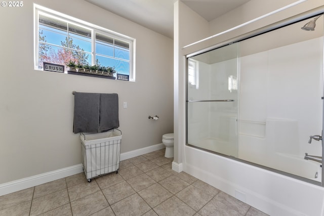 2709 Jerome Prairie Rd, Grants Pass, OR 97527 - bathroom featuring toilet, baseboards, combined bath / shower with glass door, and tile patterned flooring