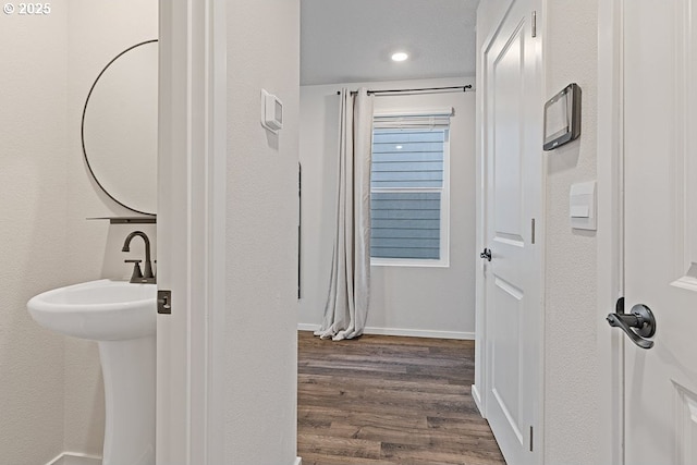 bathroom with hardwood / wood-style flooring