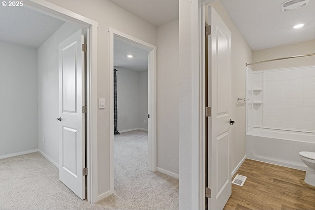 hallway with light carpet