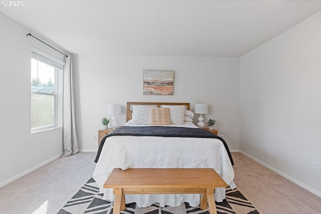 carpeted bedroom featuring a textured ceiling