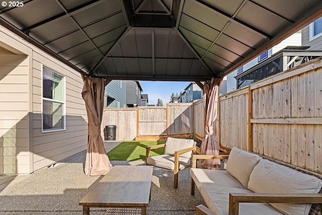 view of patio featuring an outdoor living space and a gazebo