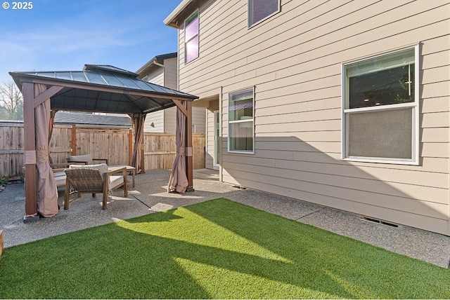 exterior space featuring a gazebo and a patio