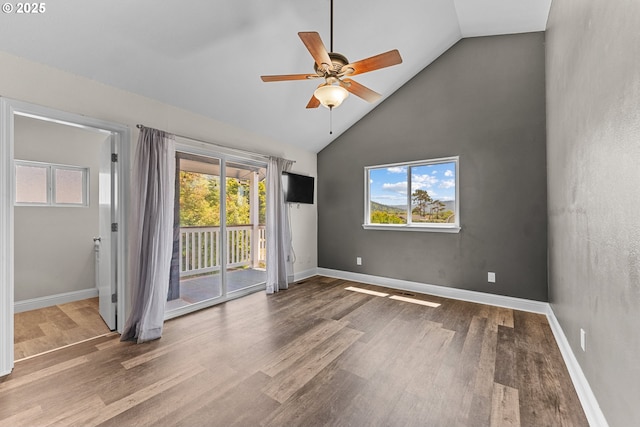 15263 Oceanview Dr, Brookings, OR 97415 - unfurnished room with a ceiling fan, wood finished floors, and high vaulted ceiling