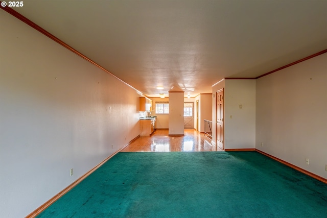 unfurnished room with light carpet, baseboards, and ornamental molding